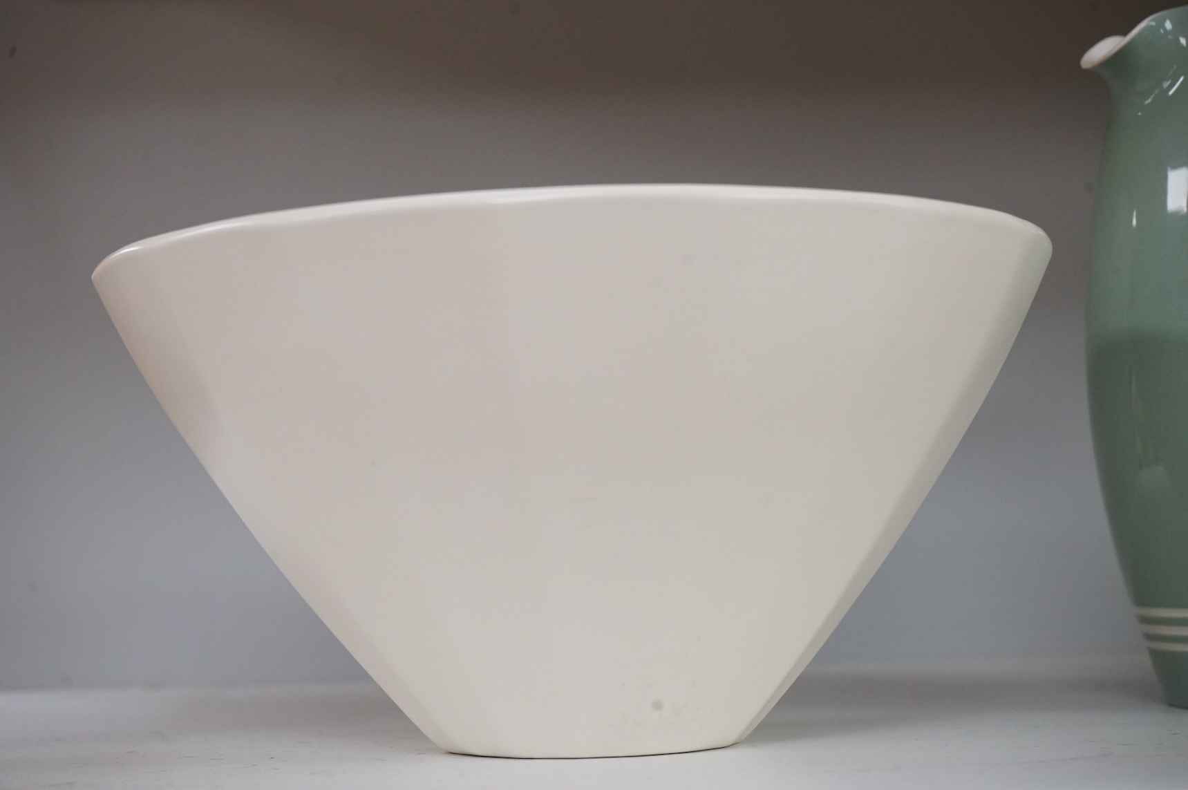 Keith Murray for Wedgwood, a cream conical bowl, 25cm diameter
